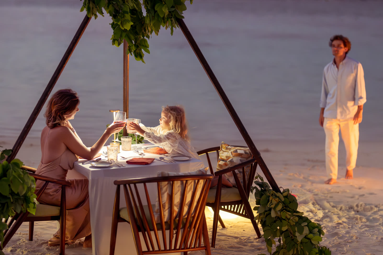 Evening beach dinner scene from an Aurion shoot